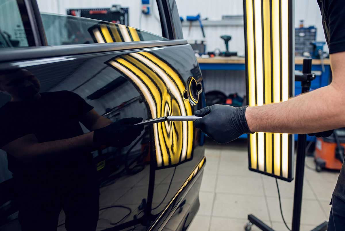 paintless dent repair photo from Adobe Stock